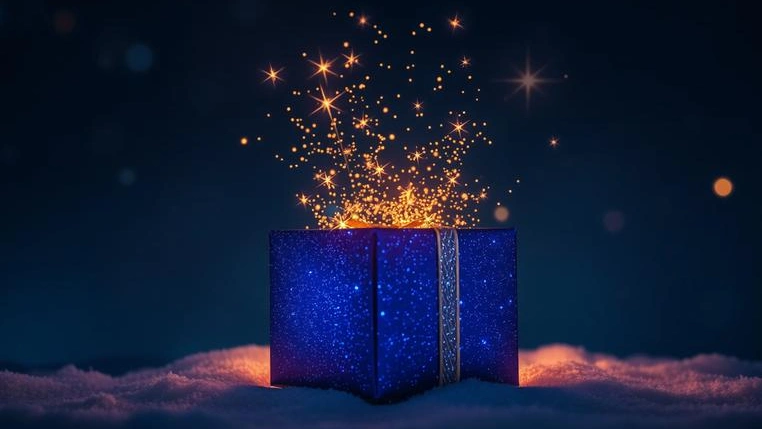 Symbolic image of a New Year gift releasing sparks of inspiration